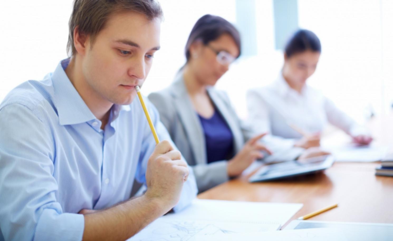 Professional financial consultation meeting with business owner reviewing strategies